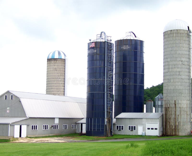 Four silos loom over the top of the barns and garages. Four silos loom over the top of the barns and garages.