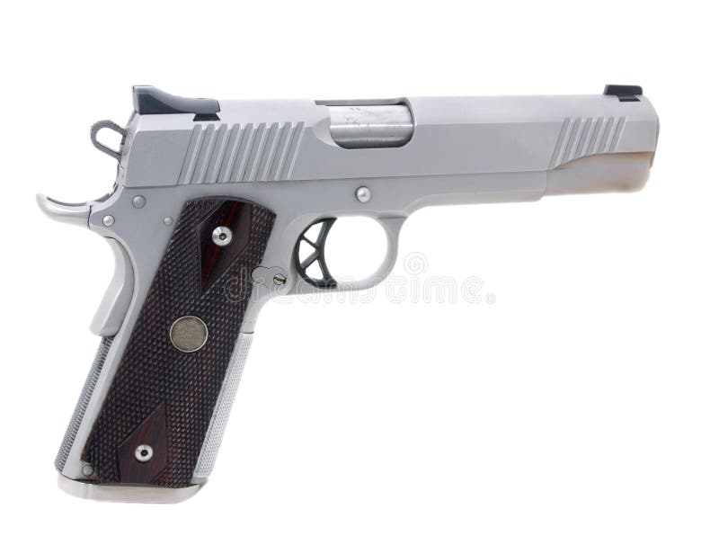 A 45 caliber semi automatic pistol, isolated. A 45 caliber semi automatic pistol, isolated