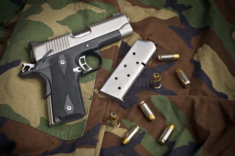45 Firearm, Pistol Clip, Gun Ammunition On Camo Stock Photo Image of