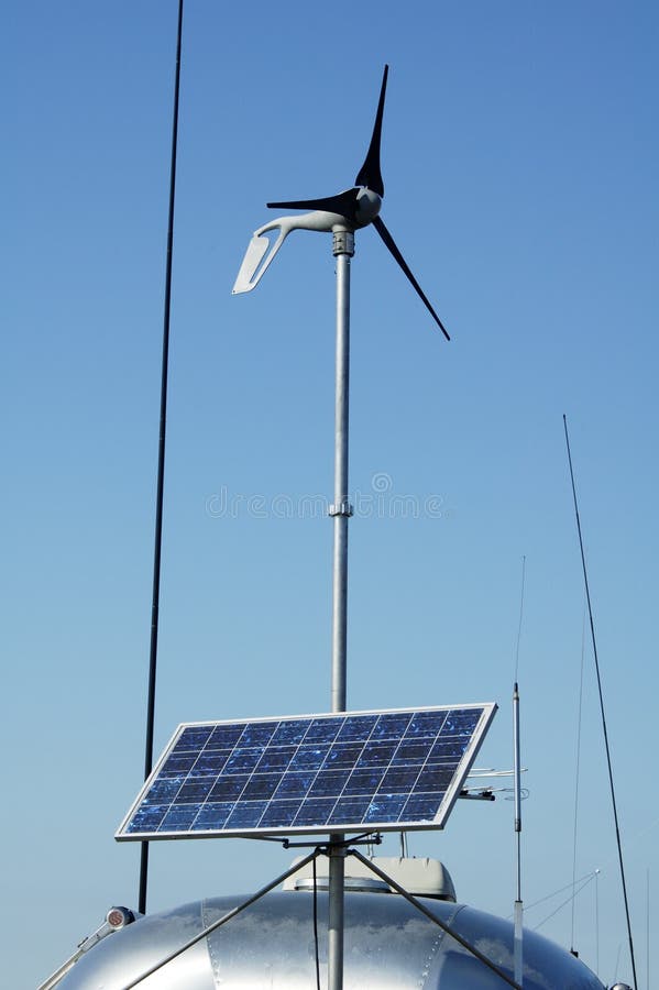 Camping in the desert with solar panels for converting energy from the sun to electricity. Camping in the desert with solar panels for converting energy from the sun to electricity.