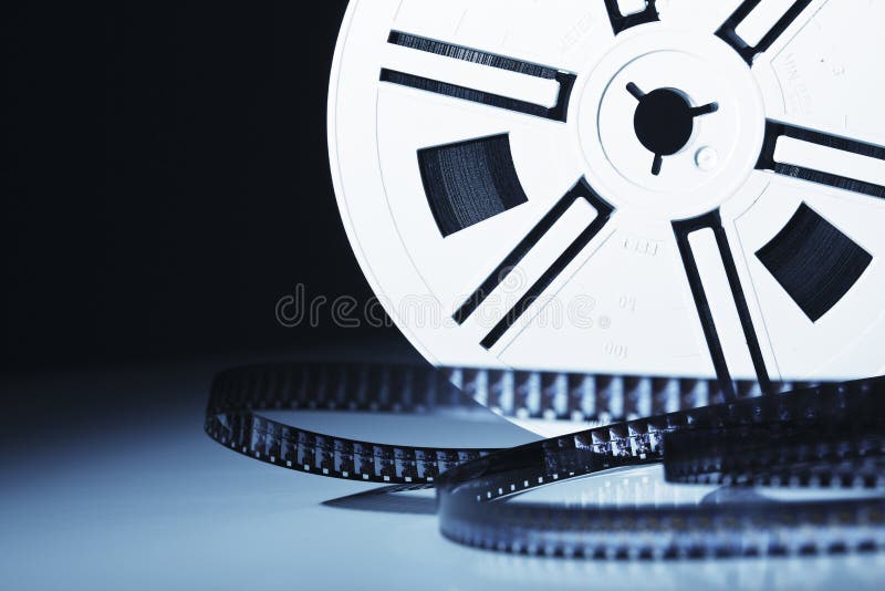 Old motion picture film reel on brown background — Stock Photo © flas100  #190552696