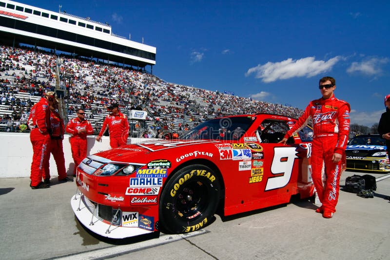 NASCAR driver Kasey Kahne stands beside of his #9 Budweiser Ford on Pit Road prior to the start of the Goody's Fast Pain Relief 500 at Martinsville Speedway in March of 2010. NASCAR driver Kasey Kahne stands beside of his #9 Budweiser Ford on Pit Road prior to the start of the Goody's Fast Pain Relief 500 at Martinsville Speedway in March of 2010.