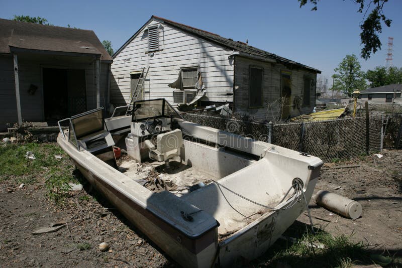 A heavily damaged home in the Ninth Ward of New Orleans. A boat without a motor sits in the front yard. A heavily damaged home in the Ninth Ward of New Orleans. A boat without a motor sits in the front yard.