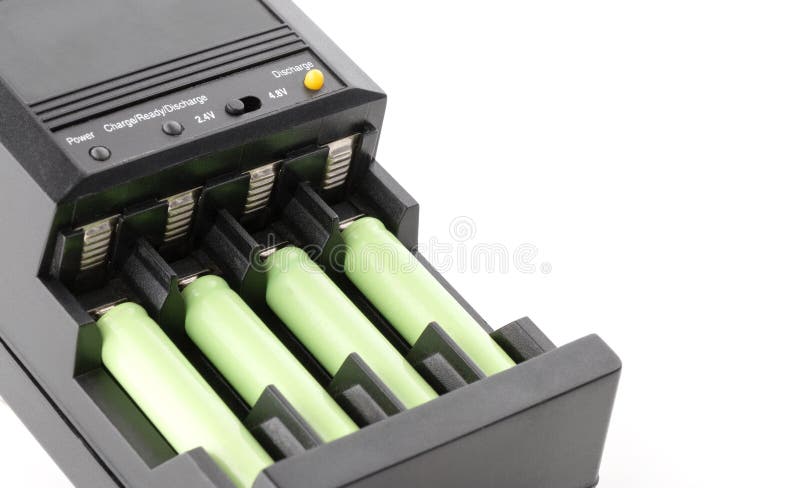 AAA batteries rechargeable in accumulator charger royalty free stock image