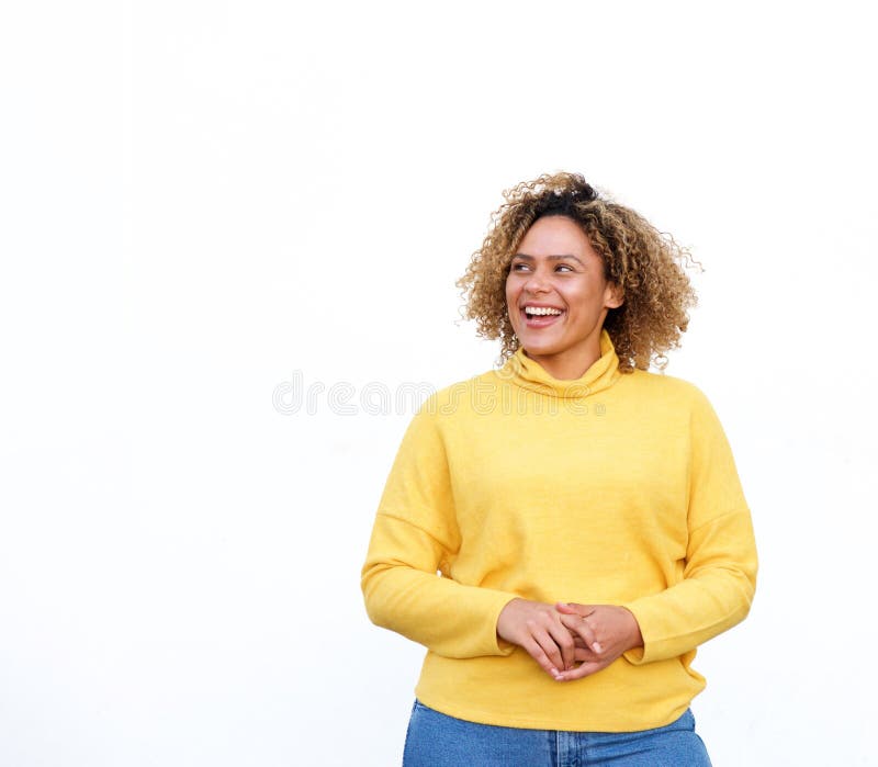 Portrait of attractive young african american woman smiling and looking away against isolated white background. Portrait of attractive young african american woman smiling and looking away against isolated white background