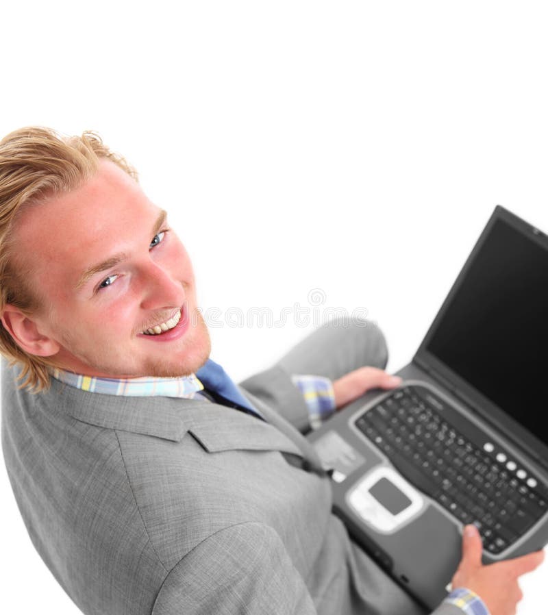 Aantrekkelijke zakenman met laptop neer zitting stock fotografie Aantrekkelijke zakenman met laptop neer zitting stock fotografie