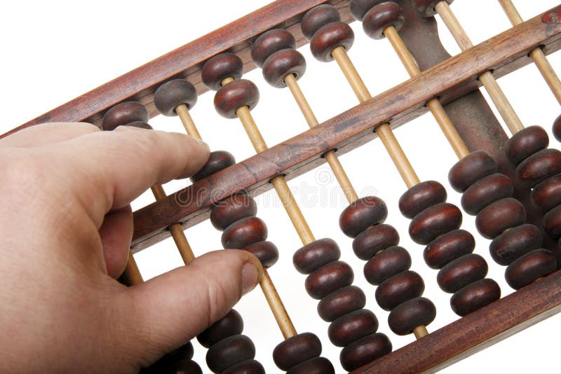 It is an old chinese abacus(Close-up). A hand using the abacus. It is an old chinese abacus(Close-up). A hand using the abacus.