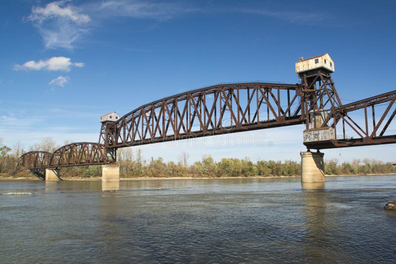 Abandoned railway bridge over a river