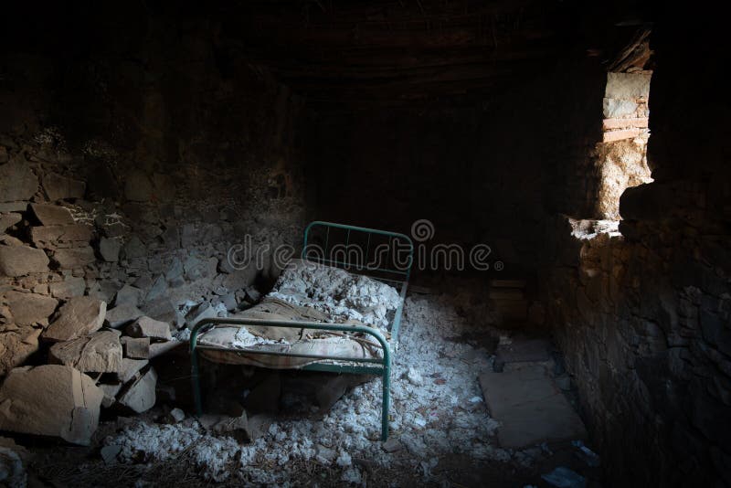 Abandoned bedroom of a house with old forgotten beds.