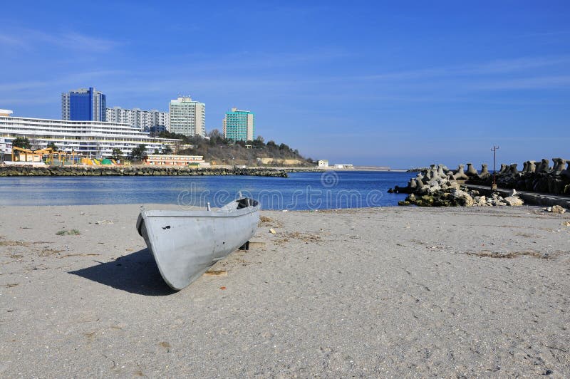 Abandoned boat on sunny beach