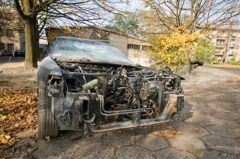 Abandoned vehicle on the street. Car without front. Abandoned vehicle on the street. Car without front.