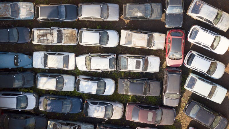 Abandoned cars being deteriorated by time. Top view.