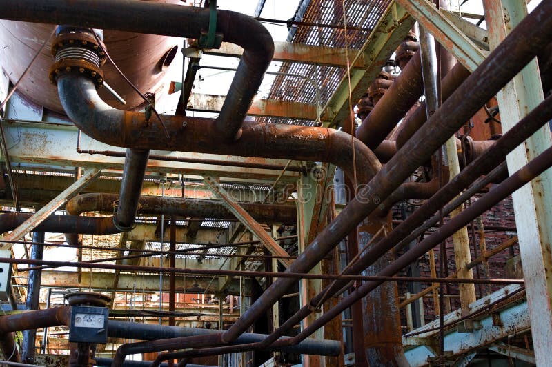 Abandoned factory pipes stock image. Image of girder 11438619