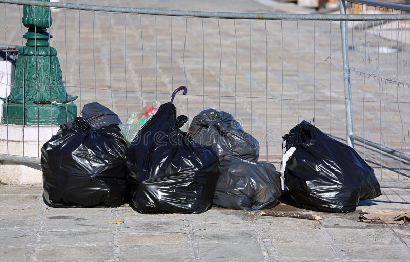 Garbage Bags Hanging on the Wall of the Houses To Prevent the Ra Stock