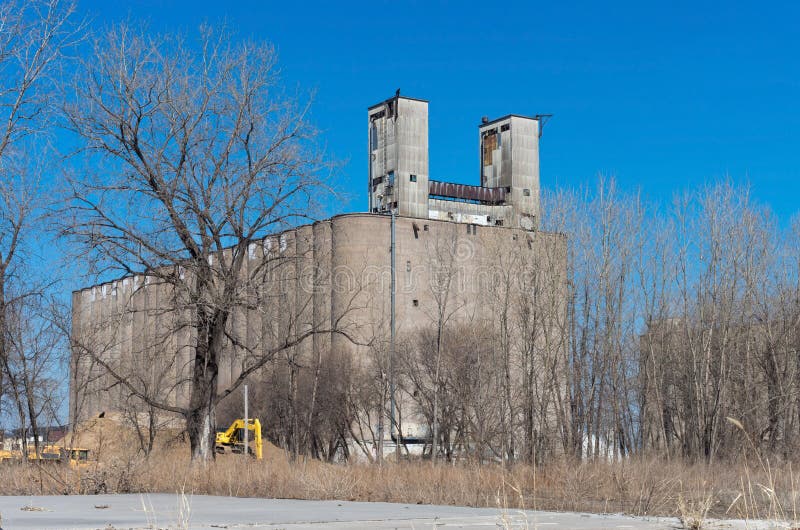 Abandoned Grain Elevator in Minneapolis. Abandoned grain elevator against blue sky in minneapolis minnesota hennepin county stock photos Abandoned Grain Elevator in Minneapolis. Abandoned grain elevator against blue sky in minneapolis minnesota hennepin county stock photos