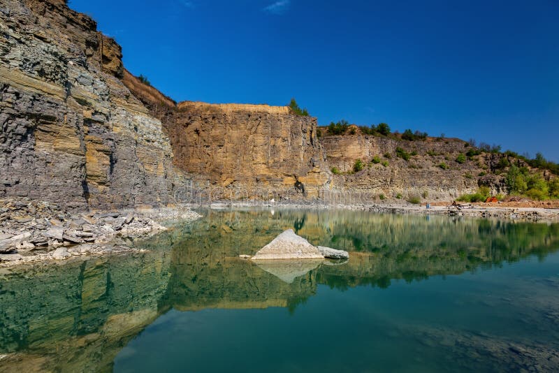 Abandoned Granite and Sand Quarry with a Lake. Stone Extraction in the