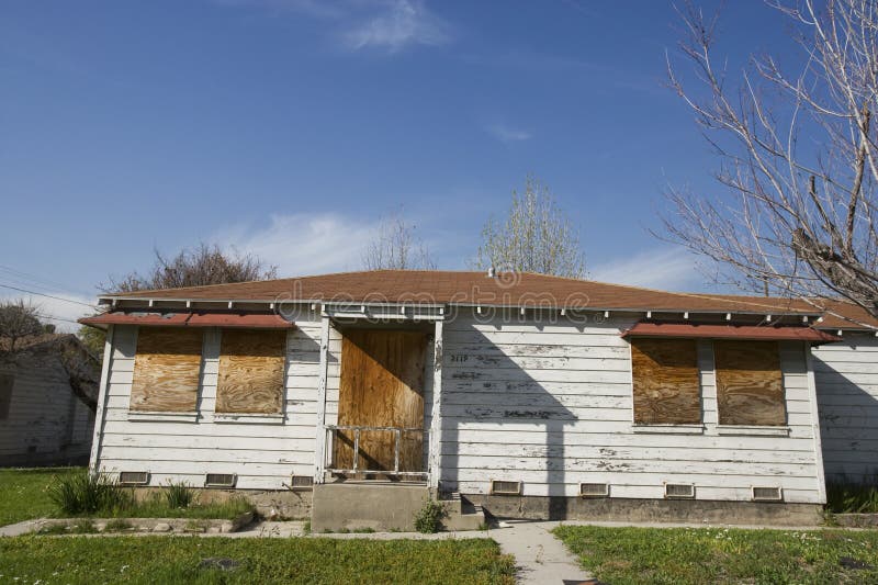 Abandoned House With Boarded Up Windows