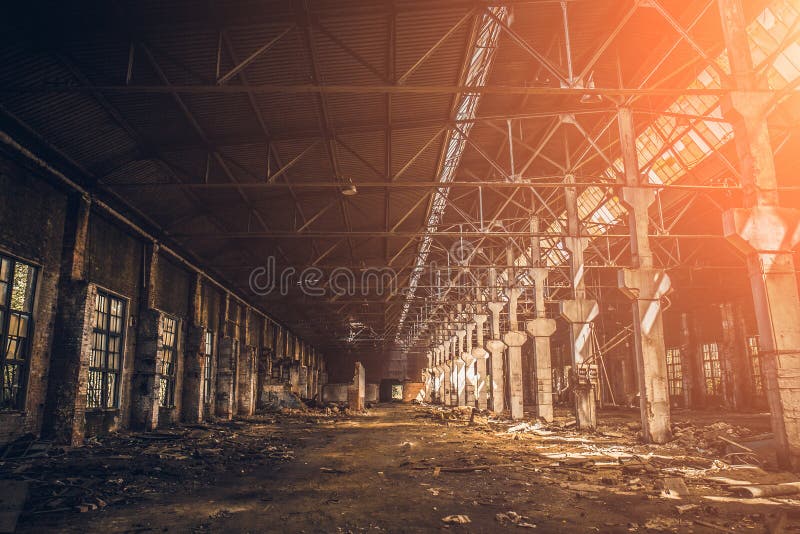 Abandoned industrial creepy warehouse inside old dark grunge factory building