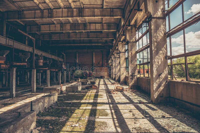 Abandoned industrial creepy warehouse inside old dark grunge factory building