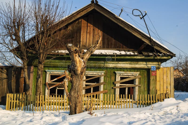 Abandoned old house in Tyumen. Russia. Wooden abandoned old house with the driven-in windows in Tyumen. Russia stock photography Abandoned old house in Tyumen. Russia. Wooden abandoned old house with the driven-in windows in Tyumen. Russia stock photography