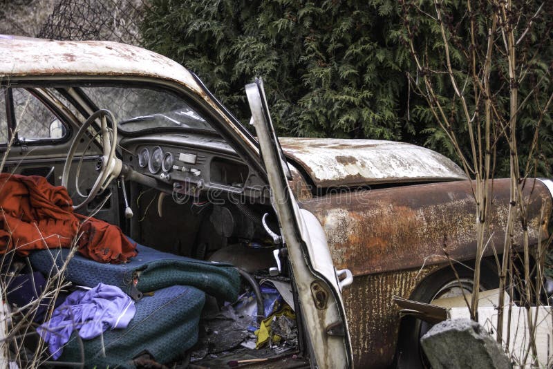 Abandoned Old Rusting Car With Front Door Open, And Dirty