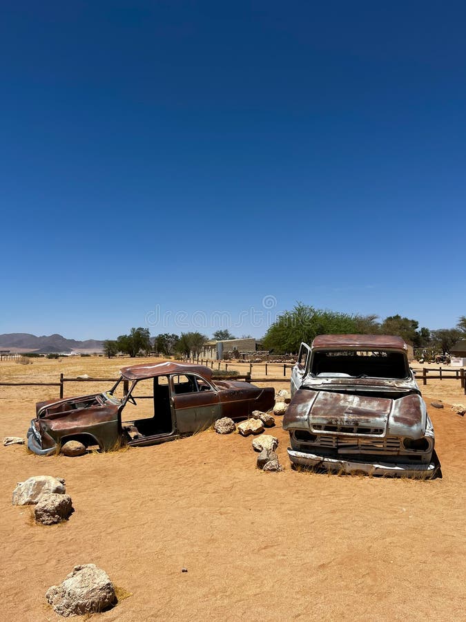 Abandoned old rusty car. Body of a retro car in the sands. Desert in Namibia, Africa. Solitaire city. Abandoned old rusty car. Body of a retro car in the sands. Desert in Namibia, Africa. Solitaire city.