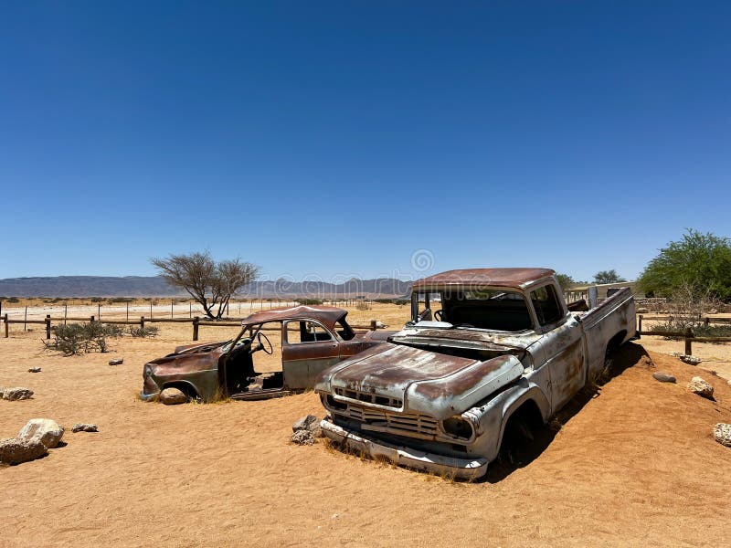 Abandoned old rusty car. Body of a retro car in the sands. Desert in Namibia, Africa. Solitaire city. Abandoned old rusty car. Body of a retro car in the sands. Desert in Namibia, Africa. Solitaire city.