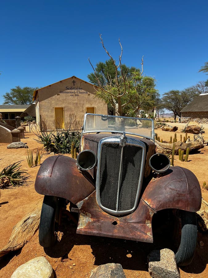 Abandoned old rusty car. Body of a retro car in the sands. Desert in Namibia, Africa. Solitaire city. Abandoned old rusty car. Body of a retro car in the sands. Desert in Namibia, Africa. Solitaire city.