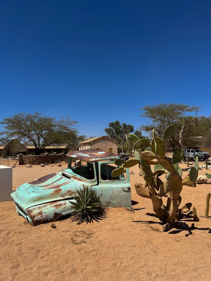 Abandoned old rusty car. Body of a retro car in the sands. Desert in Namibia, Africa. Solitaire city. Abandoned old rusty car. Body of a retro car in the sands. Desert in Namibia, Africa. Solitaire city.