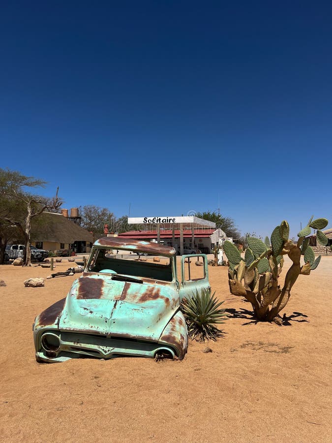 Abandoned old rusty car. Body of a retro car in the sands. Desert in Namibia, Africa. Solitaire city. Abandoned old rusty car. Body of a retro car in the sands. Desert in Namibia, Africa. Solitaire city.