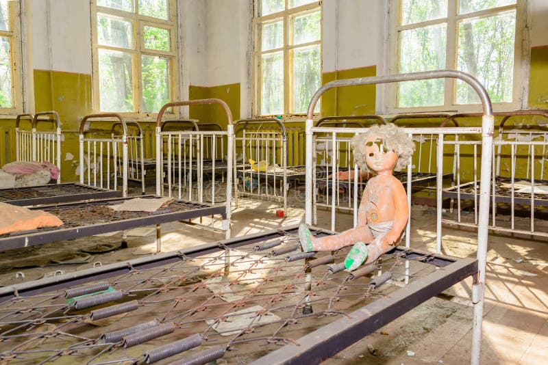 Abandoned room after the disaster. Children`s toys in the dirt in an abandoned kindergarten in Chernobyl