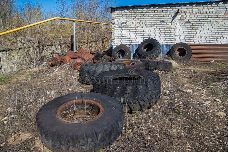 Abandoned Rotten Tires and Vehicle Wheels in the Junk Stock Photo