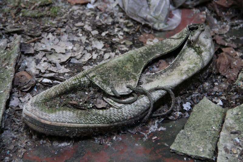 Abandoned shoe in a lost place. It`s very dangerous!