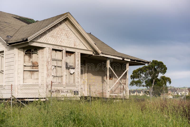 Single bungalow or family home abandoned and overgrown and in need of renovation or loving tender care. Single bungalow or family home abandoned and overgrown and in need of renovation or loving tender care