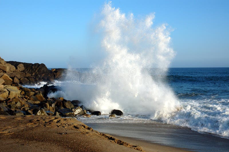 Wave crashing on rocks. Wave crashing on rocks