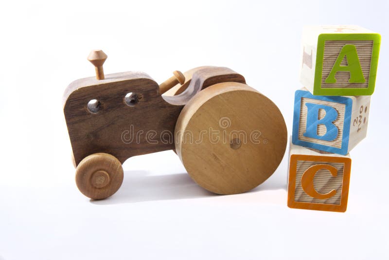 ABCs and old toy car or tractor stock photo ABCs and old toy car or tractor stock photo