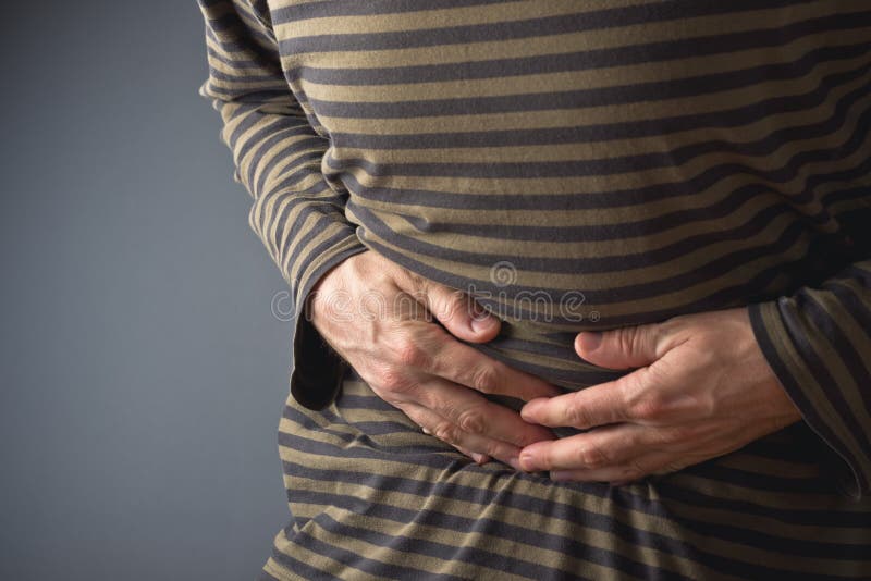 Abdominal Pain. Man holds his stomach and has hurt royalty free stock photo Abdominal Pain. Man holds his stomach and has hurt royalty free stock photo