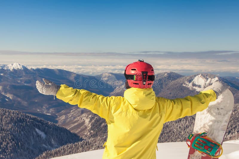 Adventure to winter sport. Snowboarder girl on the background of high mountain Alps in Switzerland. Adventure to winter sport. Snowboarder girl on the background of high mountain Alps in Switzerland.