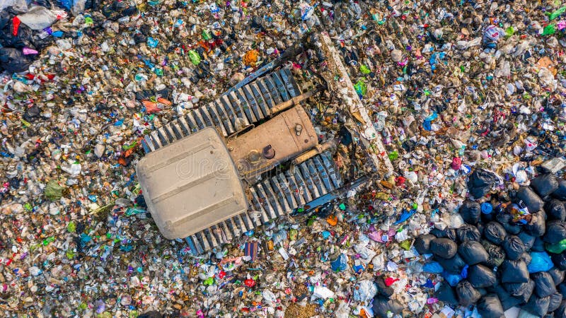 Garbage pile in trash dump or landfill, Aerial view garbage trucks unload garbage to a landfill, global warming. Garbage pile in trash dump or landfill, Aerial view garbage trucks unload garbage to a landfill, global warming.