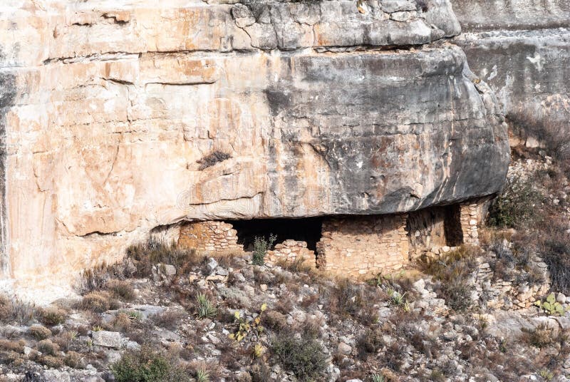 Cliff dwellings set in a vertical wall in Walnut Canyon National Monument in Arizona, United States of America. Cliff dwellings set in a vertical wall in Walnut Canyon National Monument in Arizona, United States of America