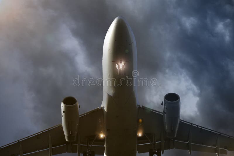 above flying airplane in evening clouds