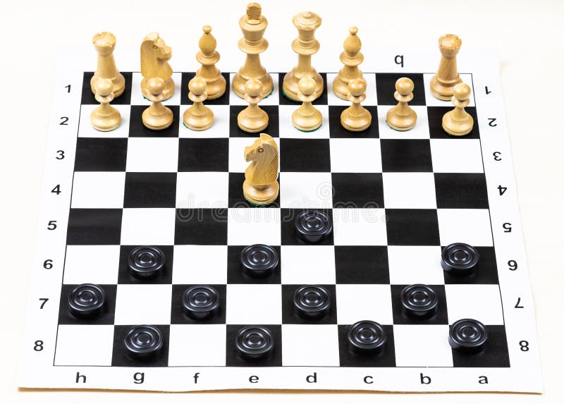 playing by different rules on the same board - black checkers and white chess figures on black white chessboard, above view of non-standard knight move (focus on the knight. playing by different rules on the same board - black checkers and white chess figures on black white chessboard, above view of non-standard knight move (focus on the knight