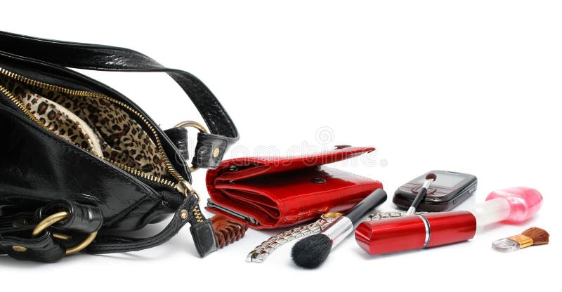 Abra el bolso negro con los accesorios cosméticos femeninos fotos de archivo Abra el bolso negro con los accesorios cosméticos femeninos fotos de archivo