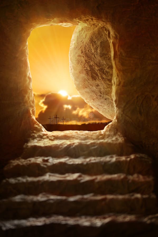 Open tomb of Jesus with sun appearing through entrance - Shallow depth of field on stone. Open tomb of Jesus with sun appearing through entrance - Shallow depth of field on stone