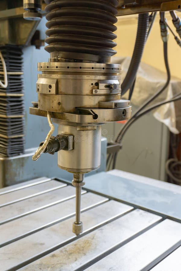 Abrasive grinding wheel on the spindle frame of a circular grinding machine stock images