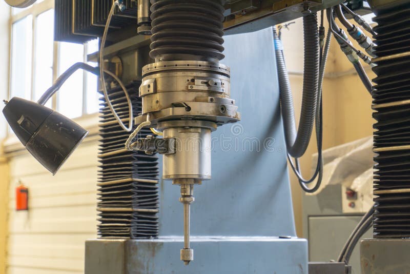 Abrasive grinding wheel on the spindle frame of a circular grinding machine royalty free stock image