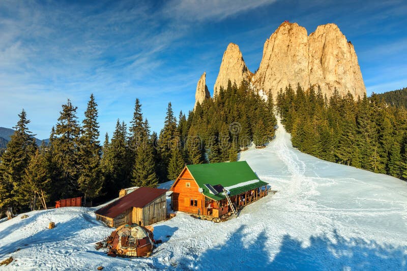 Winter landscape and wooden hut in the mountains,Lonely Rock,Transylvania,Carpathians,Romania,Europe. Winter landscape and wooden hut in the mountains,Lonely Rock,Transylvania,Carpathians,Romania,Europe