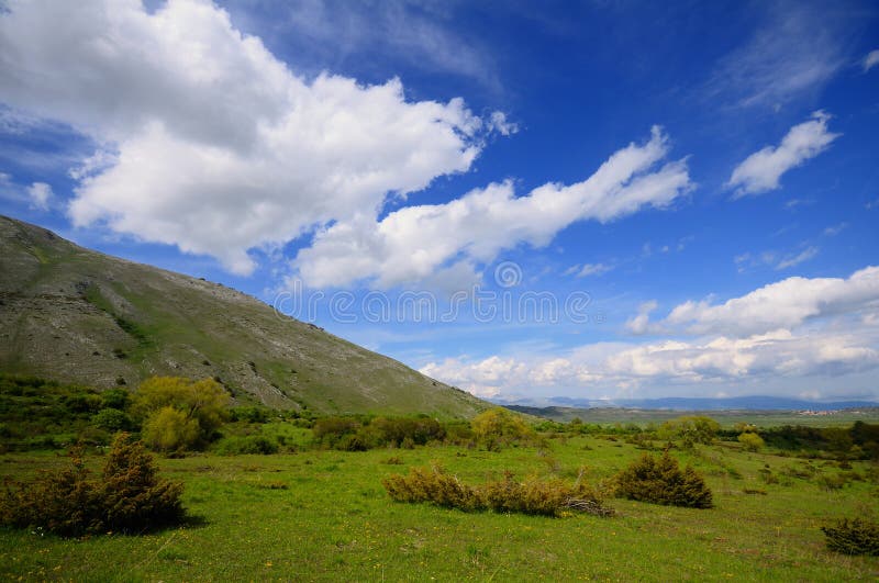 Abruzzo Highlands similar to western USA landscapes. Fair clouds and wild azure sky with very clear atmosphere. Abruzzo Highlands similar to western USA landscapes. Fair clouds and wild azure sky with very clear atmosphere.