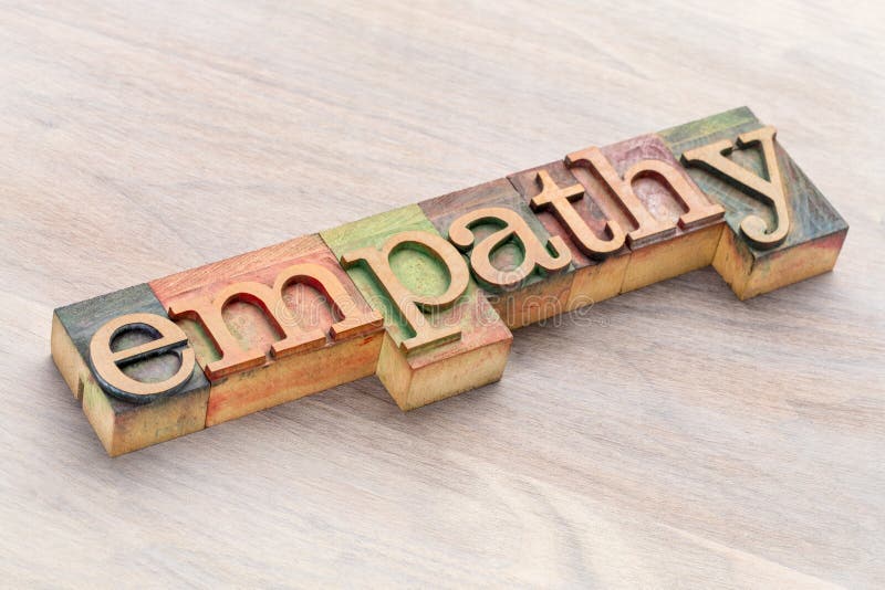 Mot 'Empathie' abstrait en caractères de bois image libre de droits