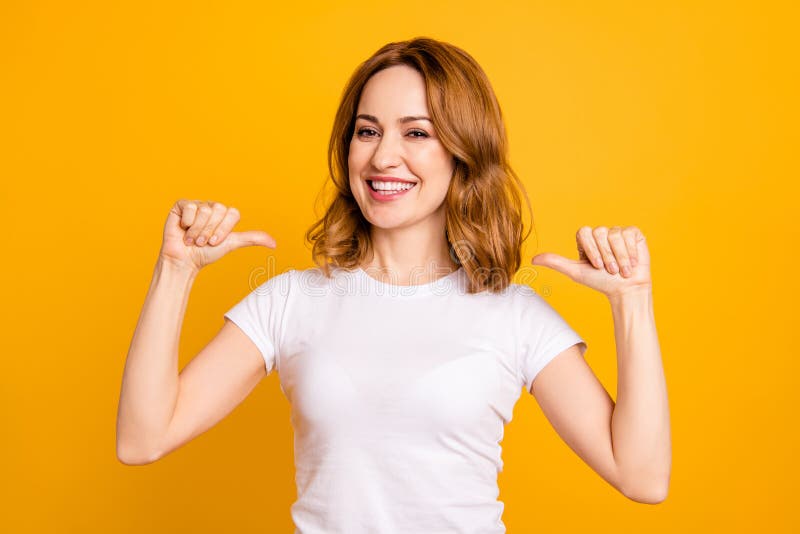 Close up photo amazing beautiful she her lady thumbs indicate direct chest self-confident toothy I am best choice choose pick select me advice wear casual white t-shirt isolated yellow background. Close up photo amazing beautiful she her lady thumbs indicate direct chest self-confident toothy I am best choice choose pick select me advice wear casual white t-shirt isolated yellow background.